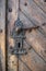 Old wooden door with a metal wrought iron lock. Castle, fortress