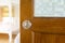 Old wooden door open with modern door handle and blur room blackground