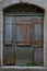 Old wooden door painted blue in the village of Labeaume, ArdÃ¨che, France.