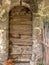 Old wooden door with a stone frame, medieval period