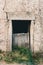 Old wooden door on a stone wall