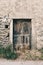 Old wooden door on a stone wall