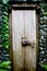 Old wooden door in a stone wall