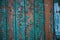 Old wooden door with teal paint