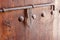 Old wooden door with vintage metal decoration latch. Arabian sty