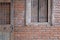 Old wooden door window & brick wall