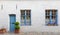 Old wooden door and window on the brick wall background