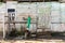 Old wooden doors on a collapsing building, a vintage barn, peeling paint, littered planks