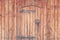 Old wooden doors with forged hinges and a lock
