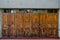 Old wooden doors in a row. Brown weathered doors. Entrance to an