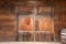 Old wooden double doors with rusty weathered hardware,