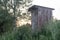 Old wooden double outhouse in the remote Russian village