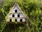 Old wooden dovecote on wall.