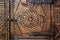 Old wooden engraved door on vintage furniture