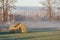 Old Wooden Farm Building At Sunrise.