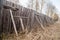 Old wooden fence, propped up with boards