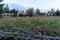 Old wooden fence. Ruins in the background.