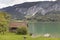 Old wooden fisherman shed on the shore of mountain lake