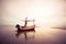 Old wooden fishing boat landing on the beach,