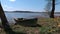 Old wooden fishing boat near lake