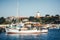 Old wooden fishing boat in port against the backdrop of the Church Of The Holy Virgin in ancient Nessebar.