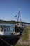 Old, wooden fishing vessels anchored along a pier in the Isle of Skye, Scotland, United Kingdom