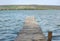 Old wooden footbridge over the lake.