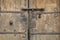 Old wooden gate with an ancient metal lock, Villefranche de Conflent, France