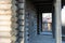 Old wooden gate of a rustic barn, rural building warehouse. Entrance to an old rural village shed, porch of a log house