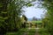 Old wooden gate in a spring green landscape