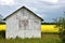 Old Wooden Granary and Canola Field