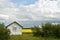 Old Wooden Granary and Canola Field