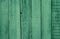 Old wooden green painted fence, beautiful background