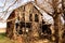 Old wooden home abandoned in the grasslands