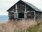 Old wooden house in Bulnes Fort, Punta Arenas, Chile with sea in the background