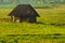 Old wooden house in the countryside. the house stands alone in the field