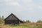 Old wooden house in the countryside. the house stands alone in the field