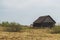 Old wooden house in the countryside. the house stands alone in the field