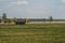 Old wooden house in the countryside. the house stands alone in the field