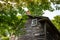 Old wooden house. Historical home. Cabin in forest