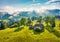 Old wooden house on the mountain valley. Misty summer scene of abandoned Carpathian village.