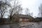 Old wooden house on the station square in Borovichi, Novgorod region