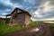 Old wooden house and the storm dramatic sky