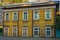 Old wooden house with windows.