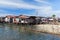 Old wooden houses and footbridges on stilts