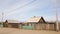 Old wooden houses in the village of Khuzhir on the island of Olkhon. Spring in Siberia on lake Baikal