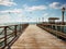 Old wooden jetty at a sea with blue sky a background