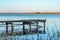 Old wooden landing stage at a tranquil lake