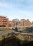 Old wooden lock gates on the canal in leeds city center surrounded by waterside apartment buildings