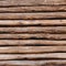 Old wooden logs background. Weathered wooden wall in brown color.